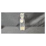 Collection of Vintage Glass Bottles, Brass Candlestick Holders, and Decorative Containers