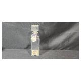 Collection of Vintage Glass Bottles, Brass Candlestick Holders, and Decorative Containers