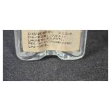 Collection of Vintage Glass Bottles, Brass Candlestick Holders, and Decorative Containers