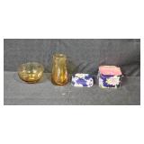 Collection of Vintage Glass Bottles, Brass Candlestick Holders, and Decorative Containers