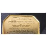 Collection of Vintage Glass Bottles, Brass Candlestick Holders, and Decorative Containers