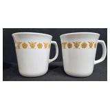 Collection of Vintage Dinnerware with Golden Floral Mugs, Glass Plates, Bowls, and Salt & Pepper Shakers