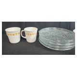 Collection of Vintage Dinnerware with Golden Floral Mugs, Glass Plates, Bowls, and Salt & Pepper Shakers