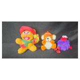 Collection of Plush Toys Including Muppets, Teddy Bears, and Holiday Dog