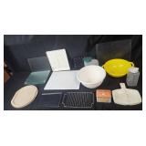 Collection of Kitchenware Items Including Glass Cutting Boards, Mixing Bowls, and Storage Containers