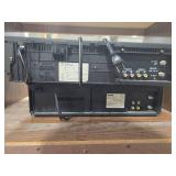 Lot of 3 VCR Players with Cords, Headphones, and Wooden Stand