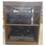 Lot of 3 VCR Players with Cords, Headphones, and Wooden Stand