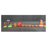 Collection of Miniature Wooden Christmas Ornaments and Plastic Display Trees