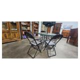 Glass Patio Table with 4 Folding Chairs and Umbrella
