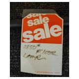 A modern "Race Track" Floor Lamp by Maria Yee.