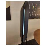 A modern "Race Track" Floor Lamp by Maria Yee.