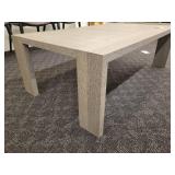 A Stylish Wood Grain Cocktail Table.