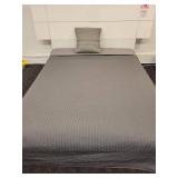 Queen Size Bed with Box Spring and Bedspread.