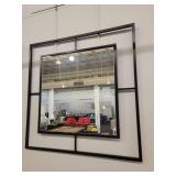 Black Iron Framed Wall Mirror with a Windowpane Design.