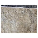 A  9" x 13" Silk Area Rug.