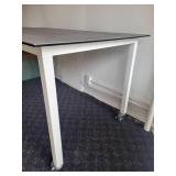 A Counter Height Table with a Ceramic Top by Johnston Casuals.