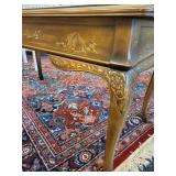 A DREXEL HERITAGE CHINOISERIE WRITING DESK WITH GLASS PROTECTOR.
