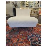 A Modern Chaise Lounge with Chrome Legs by Lazar.