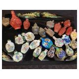 A lot of 27 Snuff Bottles. 8 bottles are missing their stops. Cinnabar. Painted. Etc.