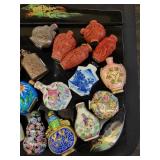 A lot of 27 Snuff Bottles. 8 bottles are missing their stops. Cinnabar. Painted. Etc.