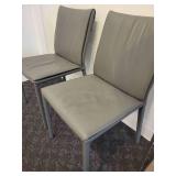 A Pair of Leather Chairs by Cattelan.