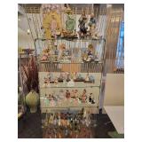 A Six Shelf Glass Display Case including all contents shown in pictures.