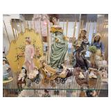 A Six Shelf Glass Display Case including all contents shown in pictures.