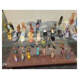 A Six Shelf Glass Display Case including all contents shown in pictures.