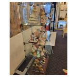 A Six Shelf Glass Display Case including all contents shown in pictures.