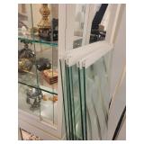 A large L Shaped Display case by Ello. Case only.  Contents not included.