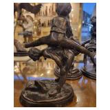 A group of 4 Bronze Statues.  Children Leapfrogging and Blindfolded Girl.