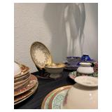 A set of 9 China Cups & Saucers, some with underplates.