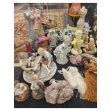 A table full of Porcelain Shoes, Figurines, Music and plain Boxes, Collectibles etc.