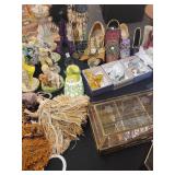 A table full of Porcelain Shoes, Figurines, Music and plain Boxes, Collectibles etc.