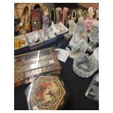A table full of Porcelain Shoes, Figurines, Music and plain Boxes, Collectibles etc.