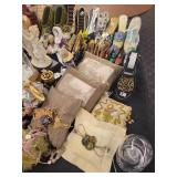 A table full of Porcelain Shoes, Figurines, Music and plain Boxes, Collectibles etc.