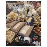 A table full of Porcelain Shoes, Figurines, Music and plain Boxes, Collectibles etc.