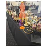 A table full of Porcelain Shoes, Figurines, Music and plain Boxes, Collectibles etc.