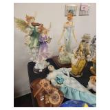 A table full of Figurines, Dolls, Glassware, Leaded Glass Sconce Cover, China, Perfumes etc.