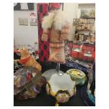 A table full of Figurines, Dolls, Glassware, Leaded Glass Sconce Cover, China, Perfumes etc.