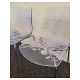 A pair of Calligaris Ice Chairs.