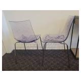 A pair of Calligaris Ice Chairs.