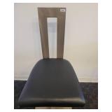 A single, very Modern Swivel Bar Stool.