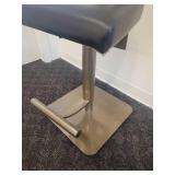 A single, very Modern Swivel Bar Stool.