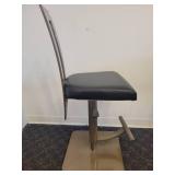 A single, very Modern Swivel Bar Stool.