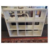 A 2 piece, 12 cubby wood storage unit in white.