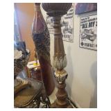 A group lot of items. Rams Head Urn, A Floor Candlestick, Decorative Metal Stand & Abstract Wood Figure.