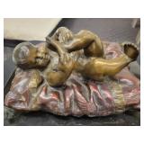 A Bronze Statue: Baby On A Pillow by Chiparrus. 10" x 9" x 6" tall.