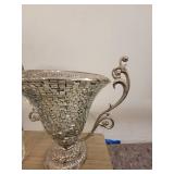 A Silver Raised Design Plant Stand with an angel and flowers, and a handled Vase / Bowl.