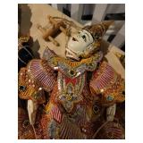 A collection of Asian themed  Items: Puppets, Photo Albums and Decor items.